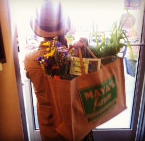 Happy Maya's Farm CSA Member Picking Up Bag